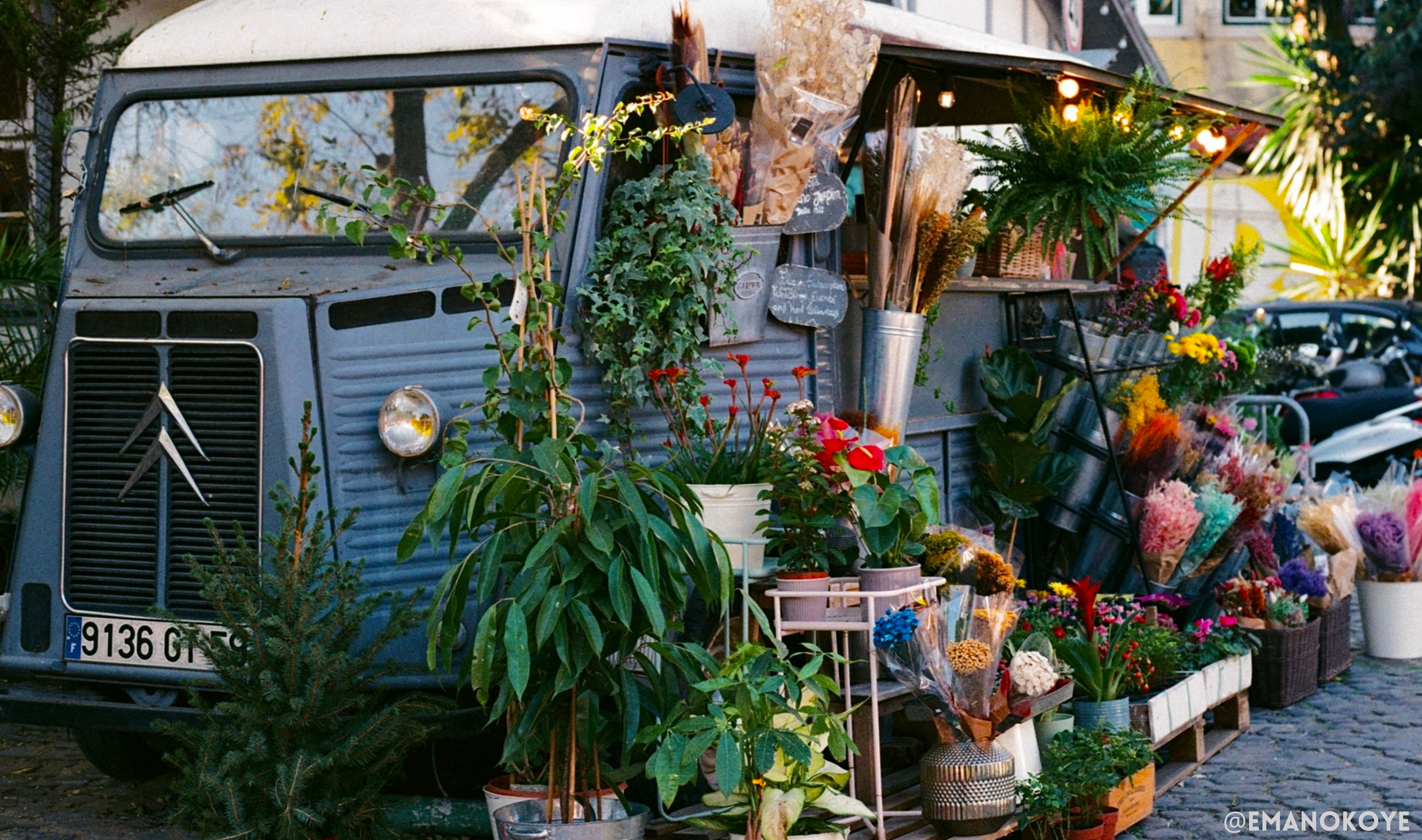 a flower shop made out of an old mercedes van