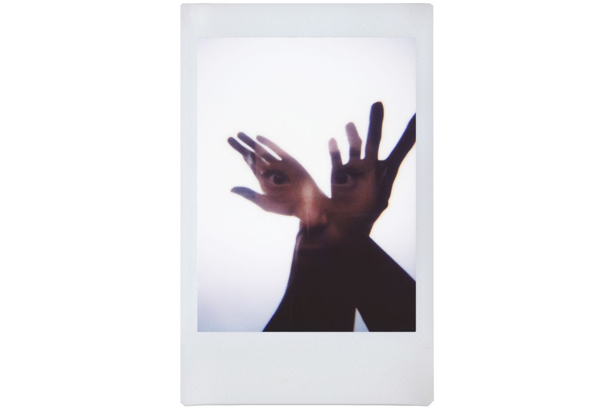 double exposure on a lomo instant mini of a lady and arms