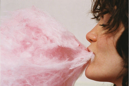 woman eating candyfloss