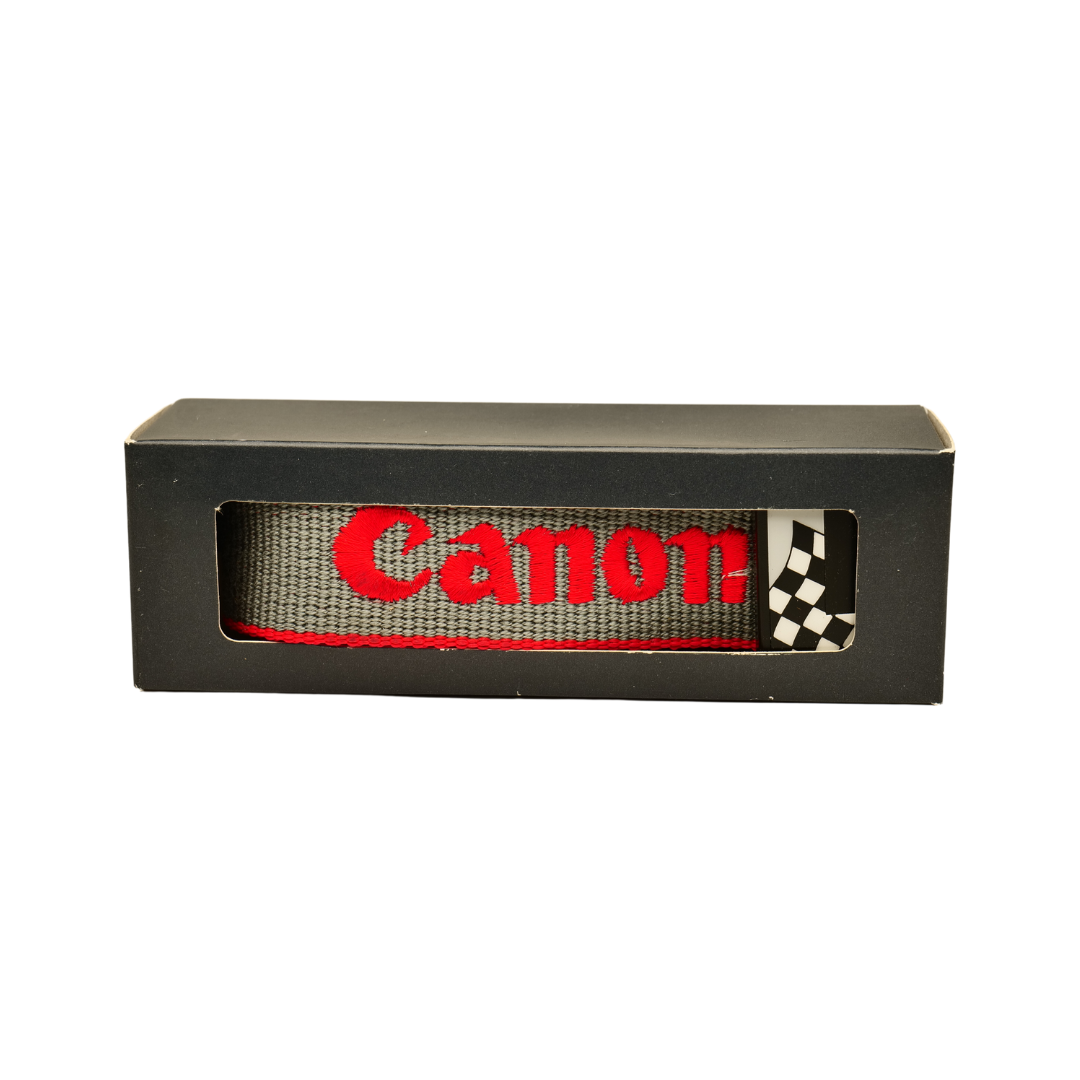 Canon Grey & Red EOS strap in its packaging